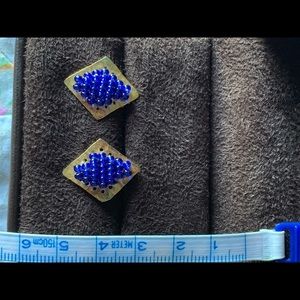 Golden earrings with blue beads